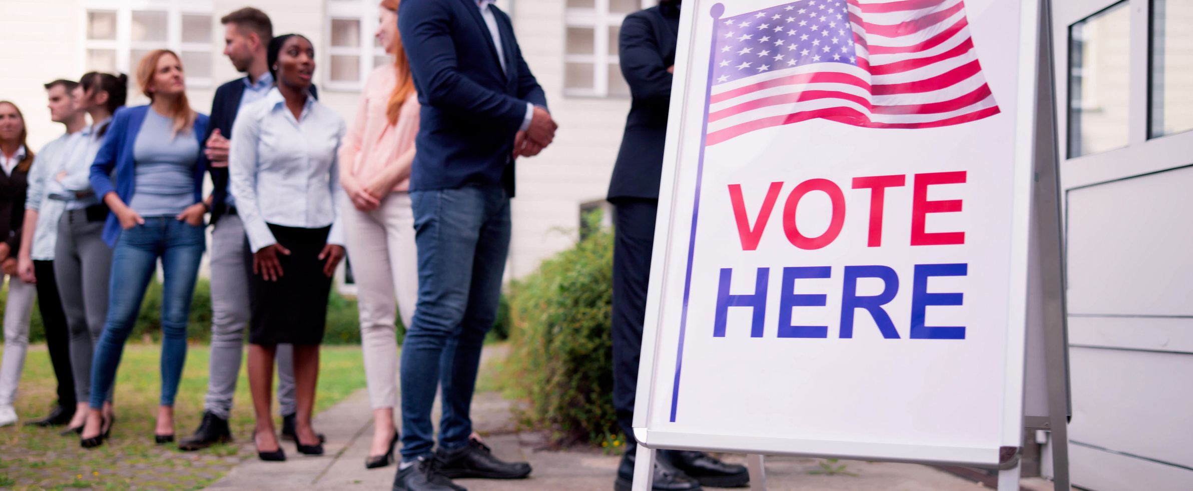Voters standing in line at the polls.