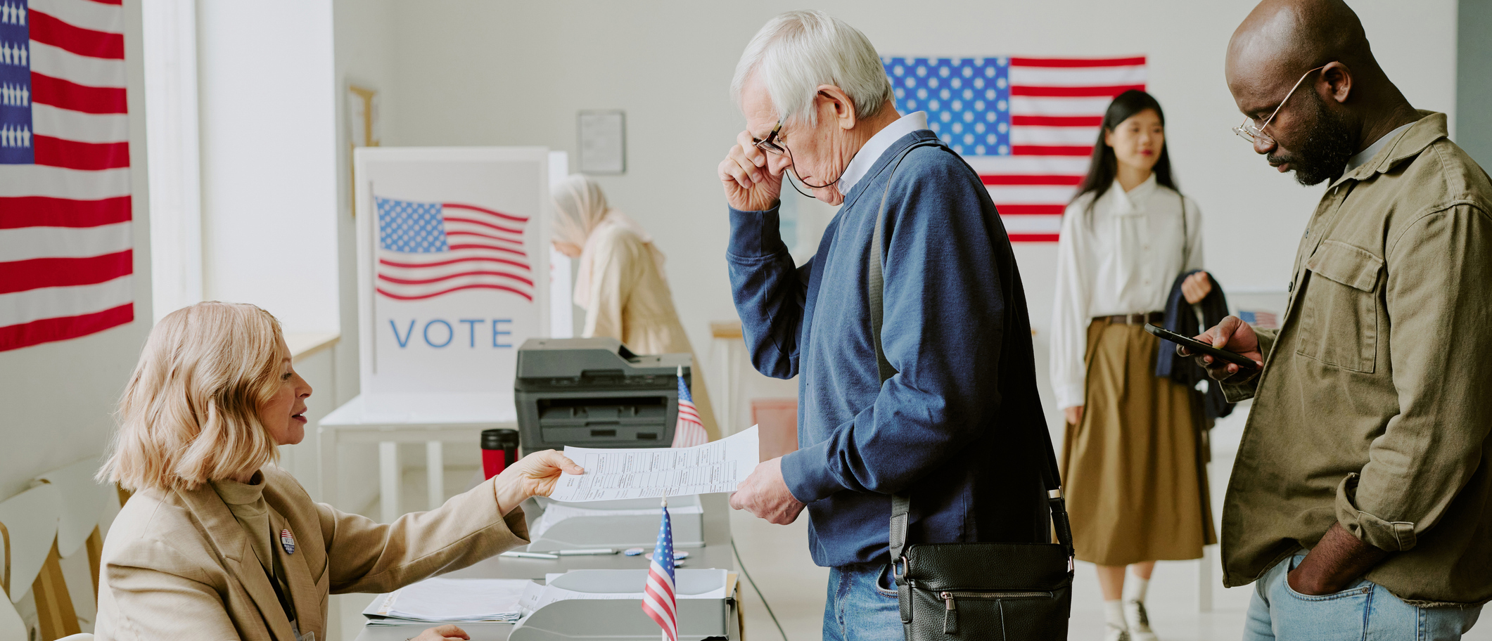 Voters standing in line at the polls.