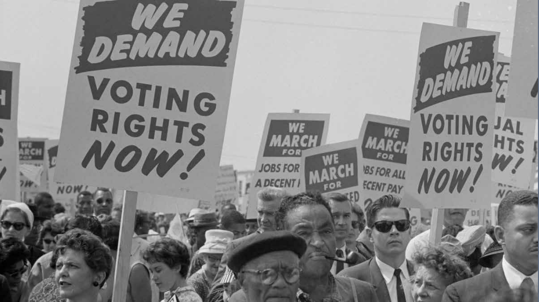 Crowd campaigning for voting rights.
