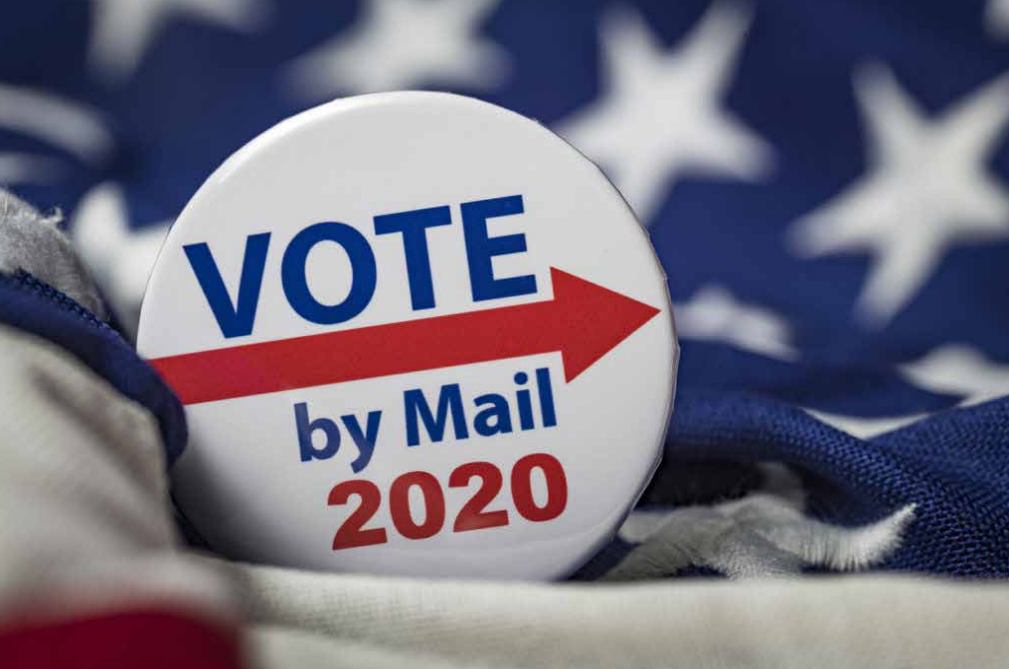 A stock photo of a "VOTE by mail 2020" button