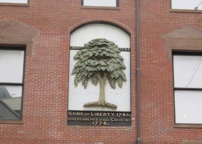 This image, in the window of a lower Washington Street 
building, marks the site of the Liberty Tree. 