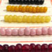 Beads. Colored glass on reproduction trade card, Europe.