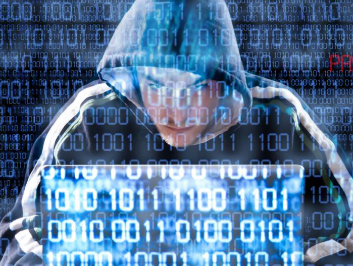 Identity theft graphic photo of a hacker at laptop