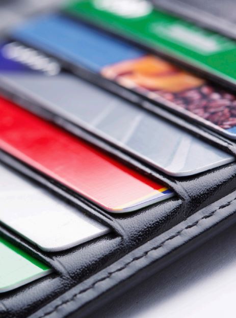 The Danger of Credit Cards. A close up of a wallet containing credit cards.